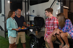 Family cooking on extior RV grill